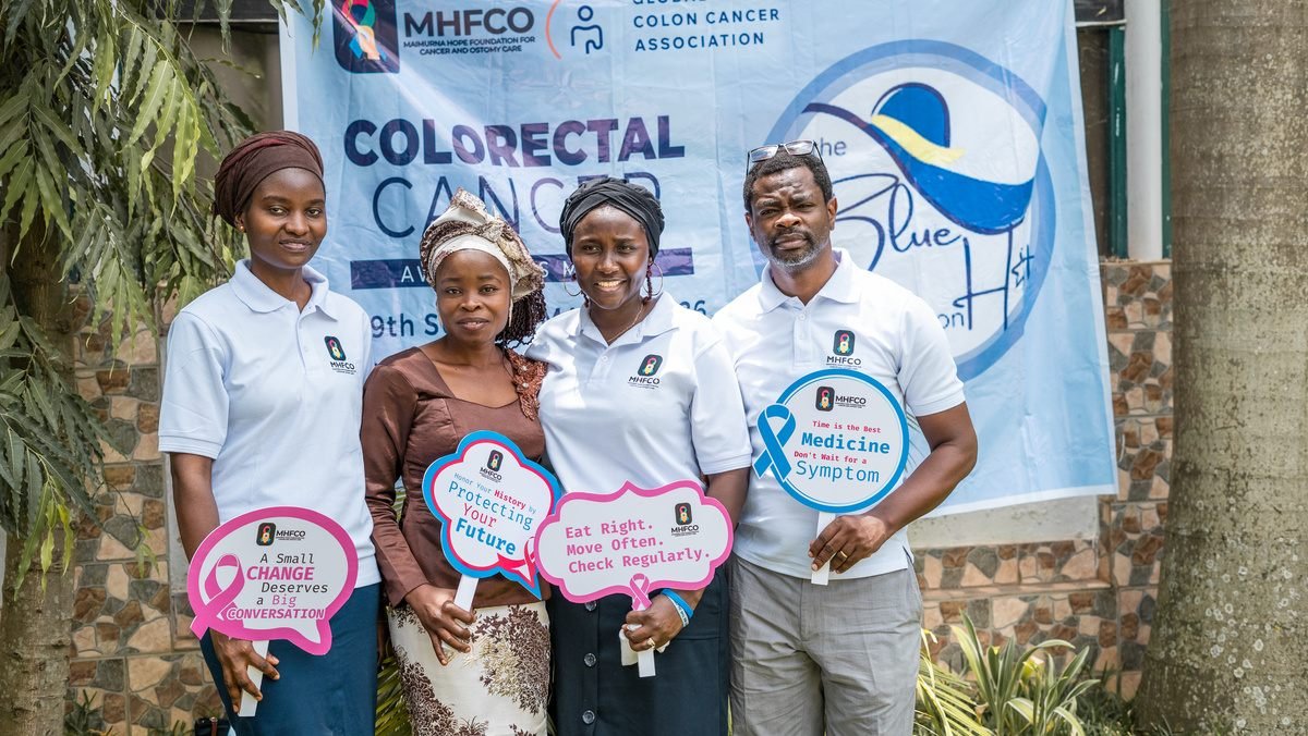MHFCO volunteers holding colorectal cancer awareness signs