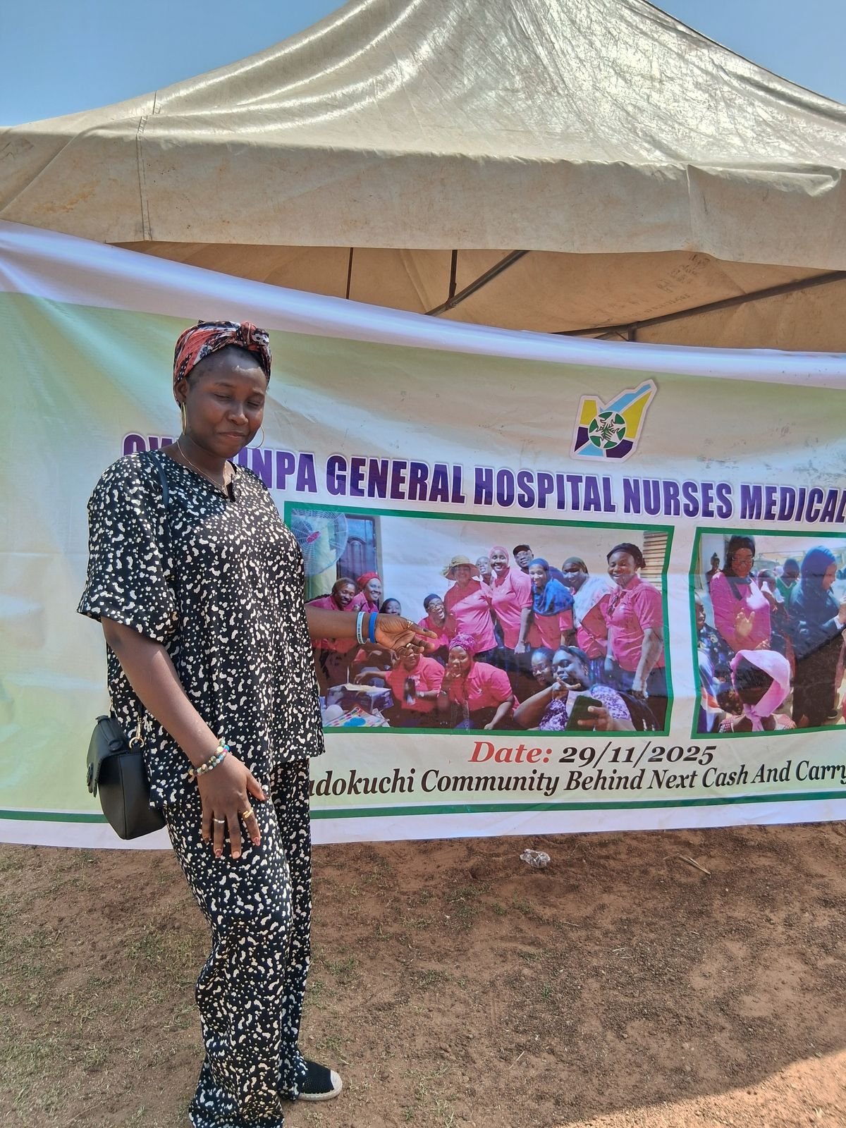 MHFCO representative at the medical outreach banner, Kadokuchi community